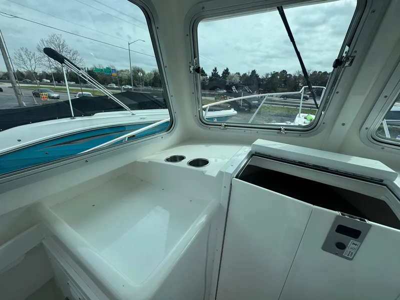 Slide: The Image of 2017 Steiger Craft 255 DV Chesapeake boat interior with windows and storage area. - 34