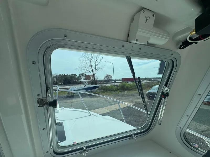 Slide: The Image of View from inside a 2017 Steiger Craft 255 DV Chesapeake boat, looking through a window. - 35