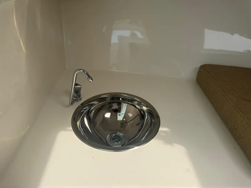 Slide: The Image of 2017 Steiger Craft 255 DV Chesapeake boat interior with sink and faucet. - 45