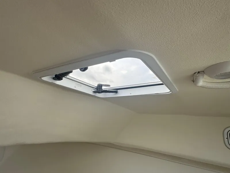 Slide: The Image of 2017 Steiger Craft 255 DV CHESAPEAKE cabin interior with open ceiling hatch. - 46