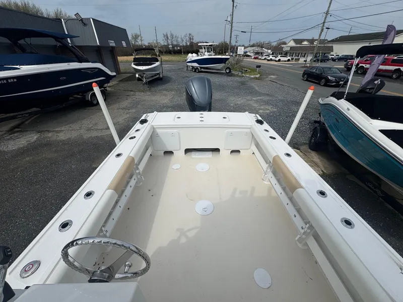 Slide: The Image of 2017 Steiger Craft 255 DV Chesapeake boat, spacious deck, parked in a marina. - 6