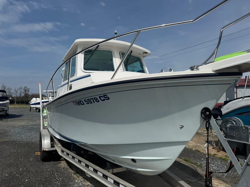 Slide: The Image of 2017 Steiger Craft 255 DV Chesapeake boat on trailer, side view, under clear sky. - 8
