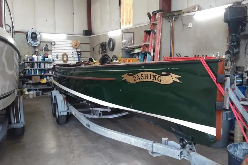 Slide: The Image of Classic 1990 English Launch boat "Dashing" in workshop on trailer. - 2
