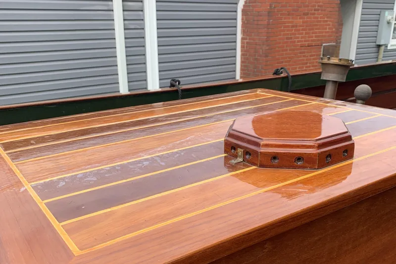 Slide: The Image of Polished wooden deck of a 1990 Classic English Launch boat, showcasing elegant craftsmanship. - 34