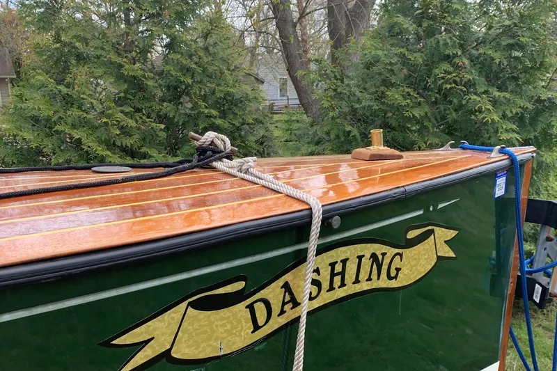 Slide: The Image of Classic 1990 English Launch boat named "Dashing" with wooden deck and green hull. - 38