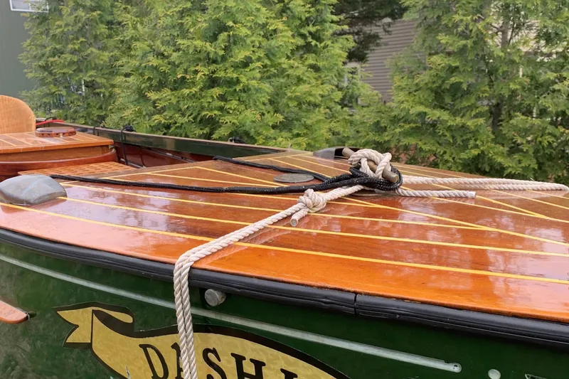 Slide: The Image of Classic 1990 English Launch boat with polished wooden deck and rope detail. - 42