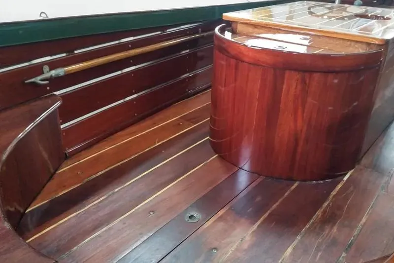 Slide: The Image of Interior of a 1990 Classic English Launch boat with polished wooden finish. - 6