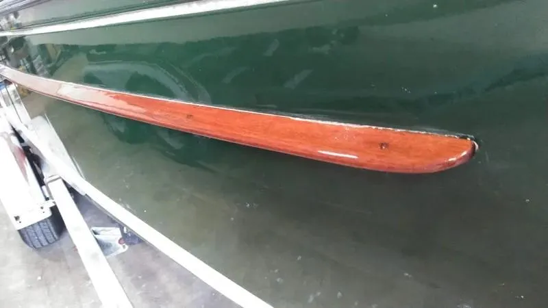 Slide: The Image of Classic English Launch 1990 with green hull and wooden trim detail. - 7