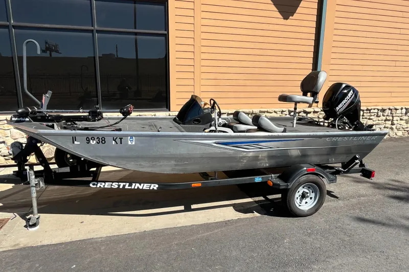 Slide: The Image of 2016 Crestliner 1600 Storm fishing boat on trailer, parked outdoors. - 4