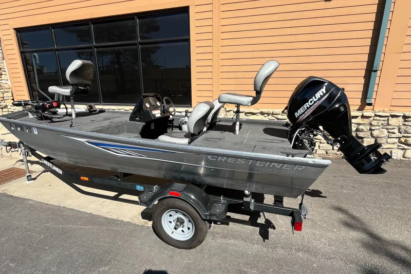 Slide: The Image of 2016 Crestliner 1600 Storm fishing boat with Mercury outboard motor on trailer. - 5
