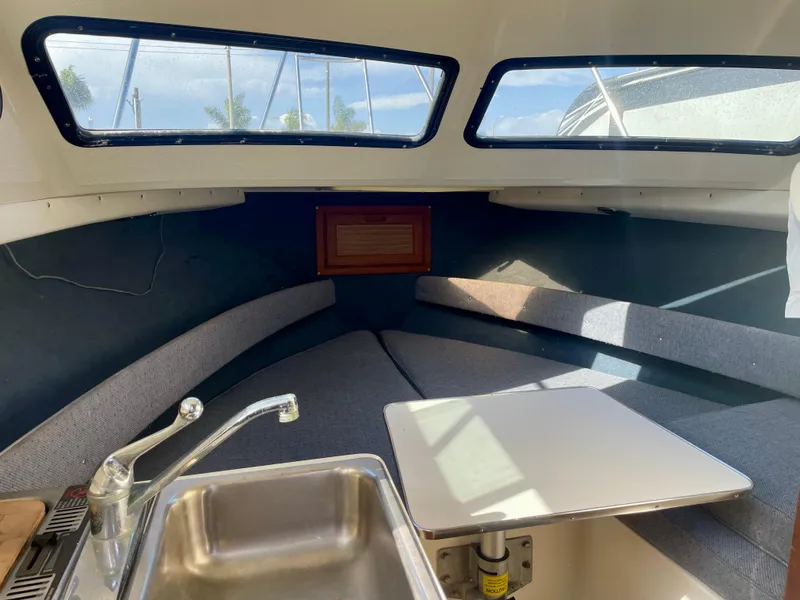 Slide: The Image of Interior of 1993 Skipjack 263 Fisherman boat with sink and seating area. - 10