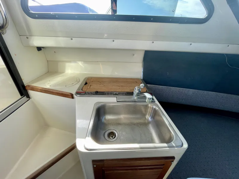 Slide: The Image of 1993 Skipjack 263 Fisherman boat interior with sink and countertop. - 13