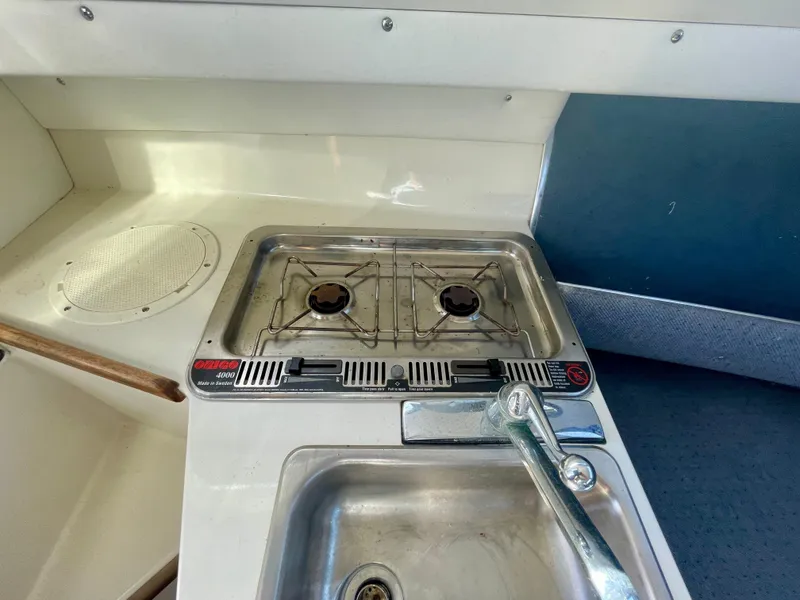 Slide: The Image of 1993 Skipjack 263 Fisherman boat kitchen with stove and sink. - 15