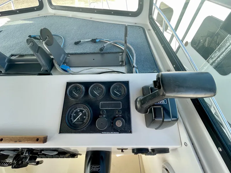 Slide: The Image of 1993 Skipjack 263 Fisherman boat dashboard with gauges and controls. - 19