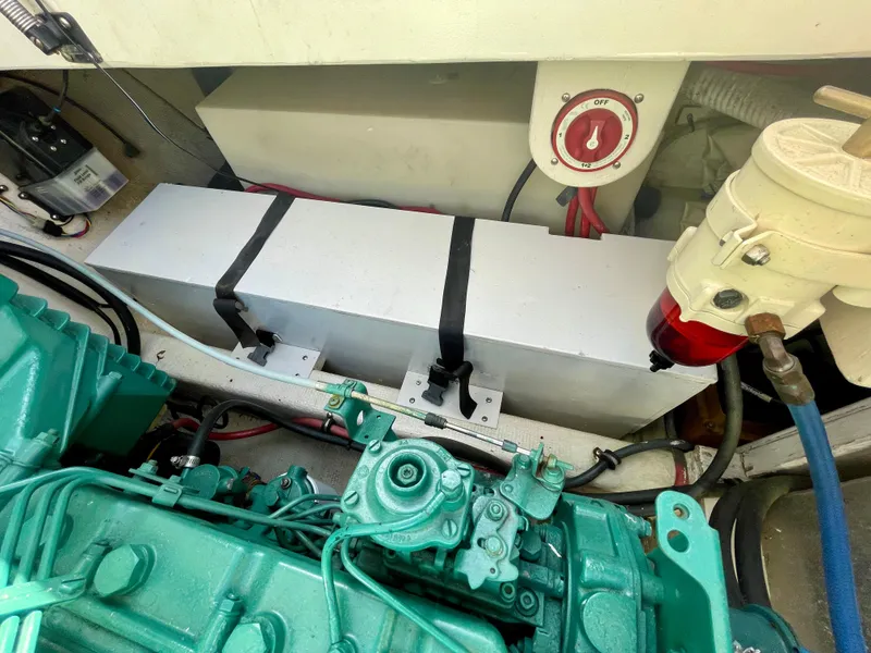 Slide: The Image of Engine compartment of 1993 Skipjack 263 Fisherman with visible components and wiring. - 27
