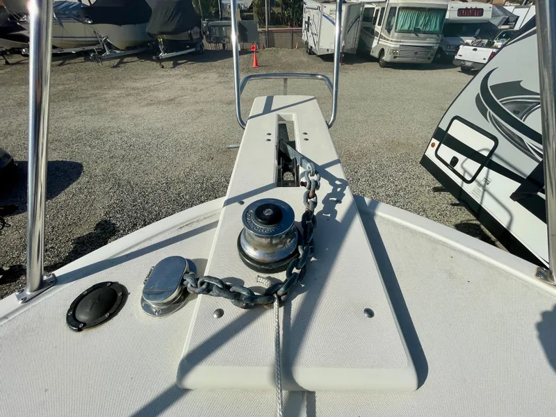 Slide: The Image of Bow of 1993 Skipjack 263 Fisherman with anchor chain and winch in a marina. - 29
