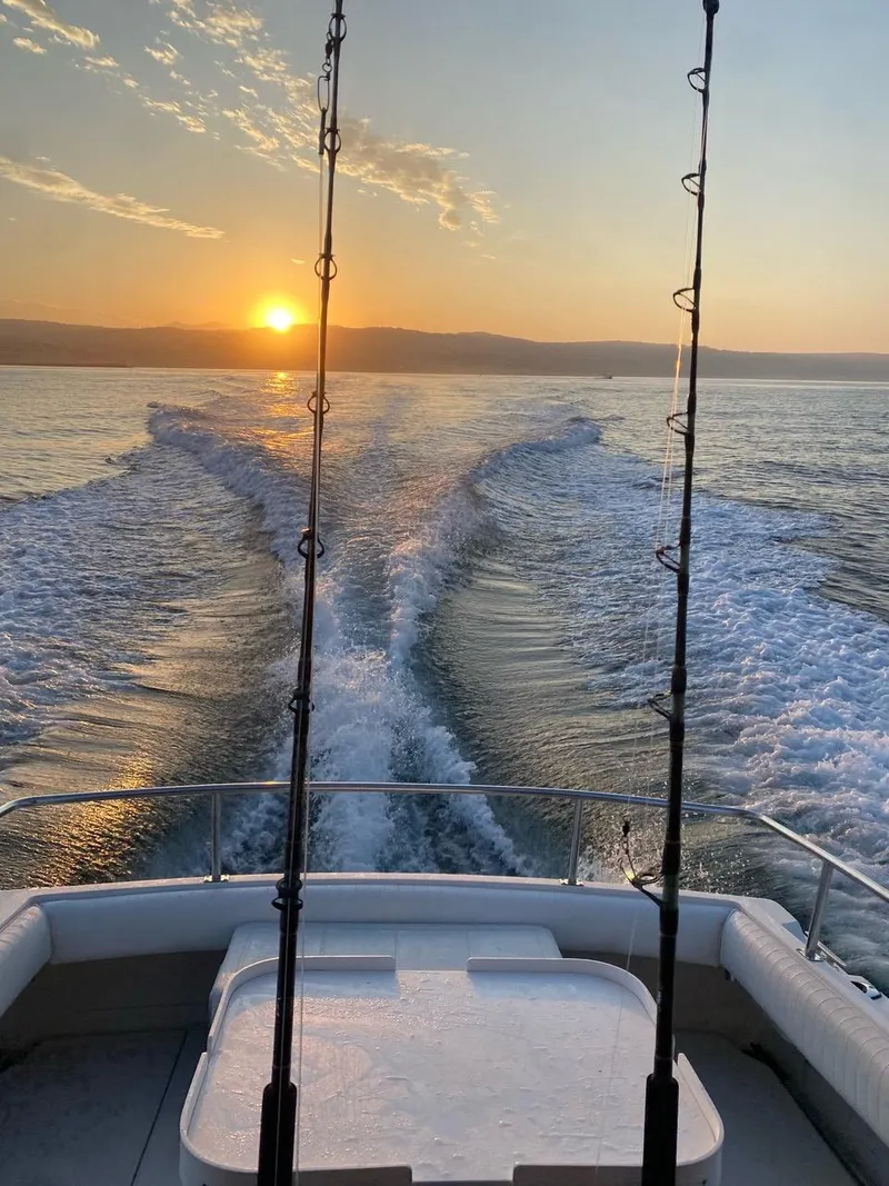 Slide: The Image of Skipjack 263 Fisherman boat cruising at sunset, 1993 model. - 30