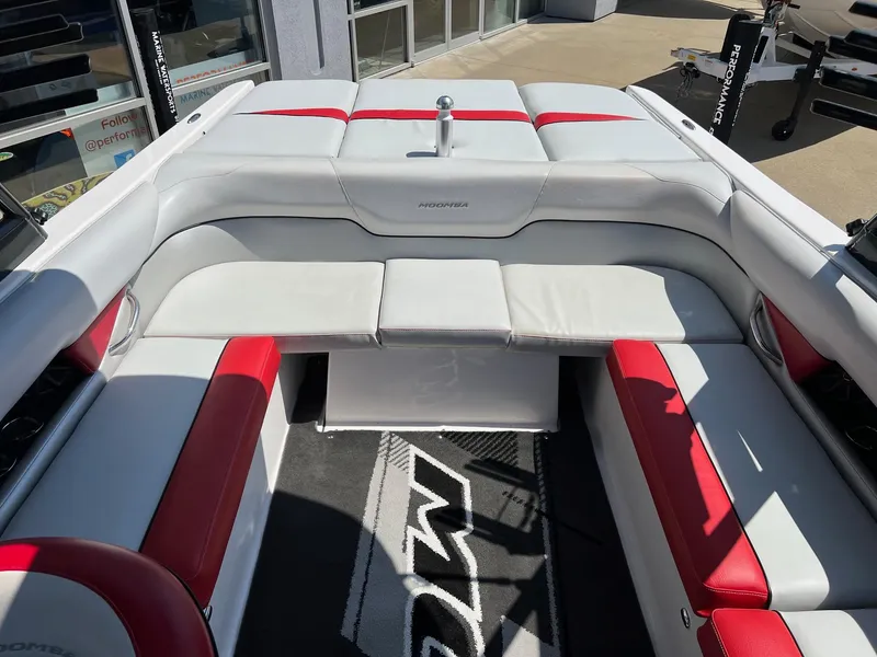 Slide: The Image of 2013 Moomba Mojo 2.5 boat interior with white and red seating, modern design. - 12