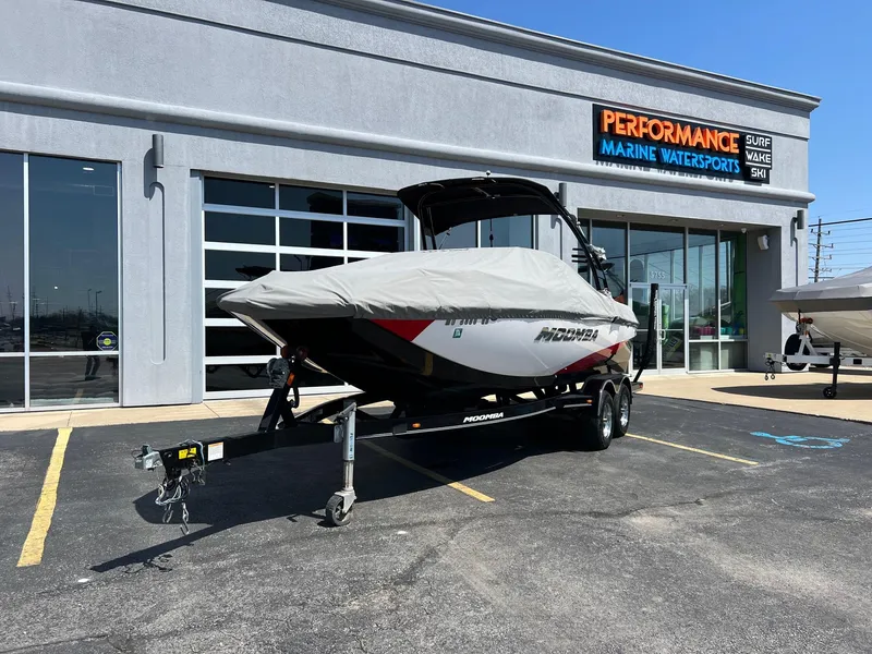 Slide: The Image of 2013 Moomba Mojo 2.5 boat on trailer outside Performance Marine Watersports shop. - 17