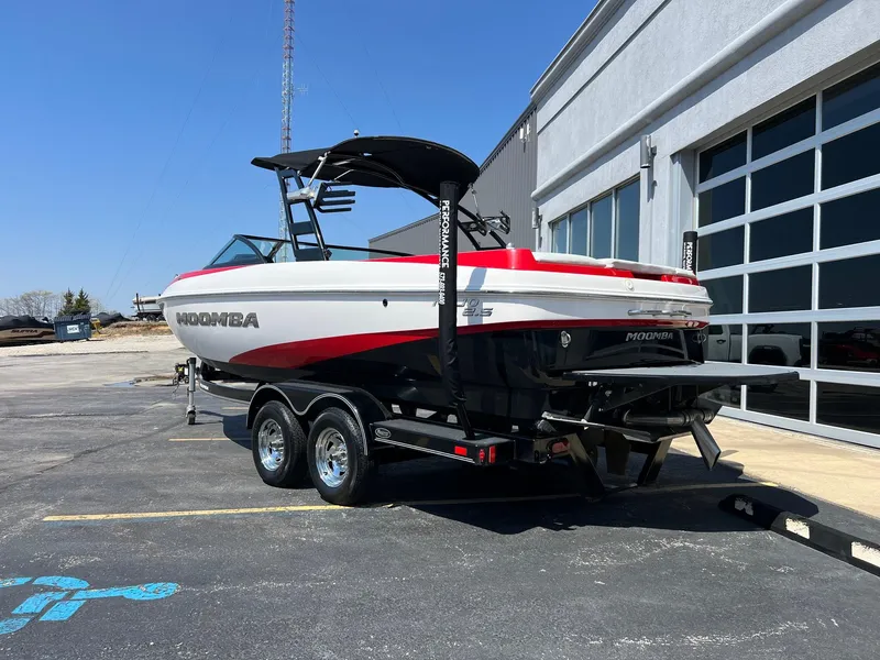 Slide: The Image of 2013 Moomba Mojo 2.5 boat on trailer, parked outside a building. - 4