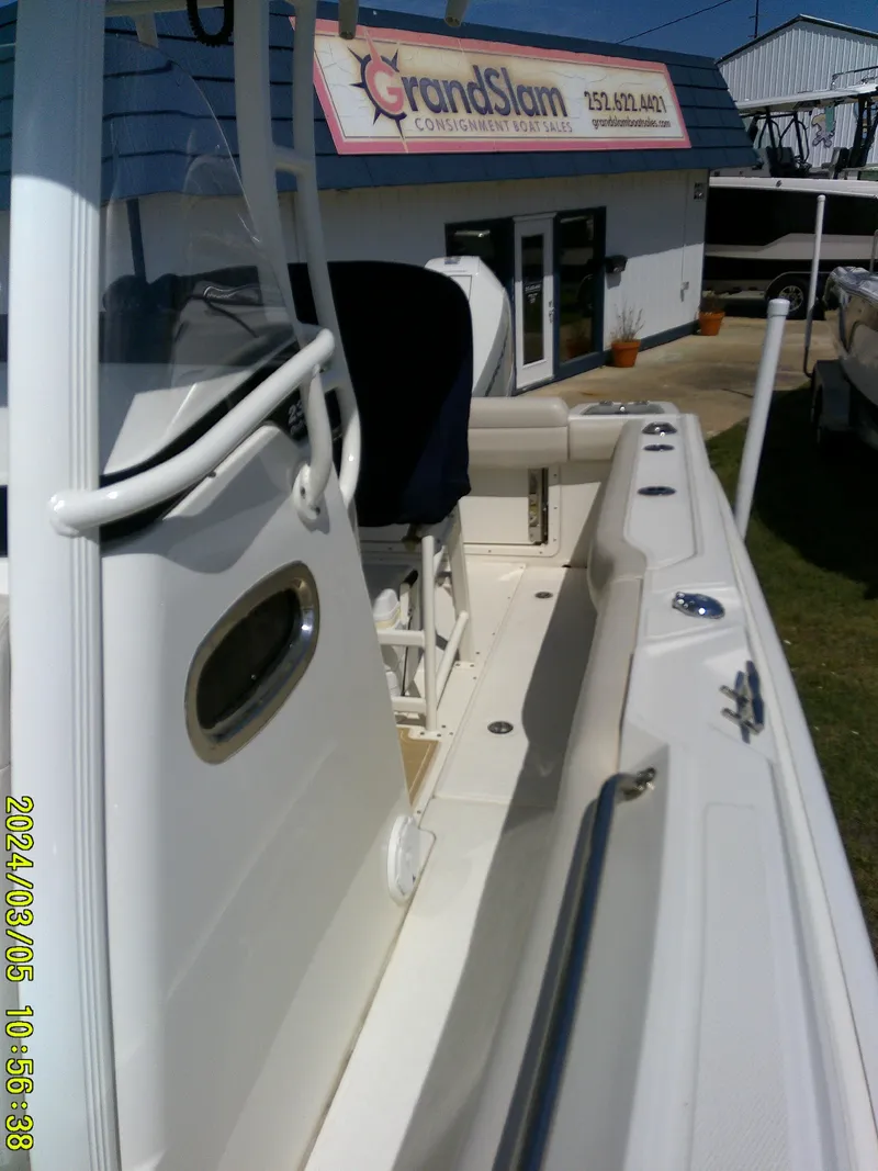 Slide: The Image of 2021 Boston Whaler Outrage 230 boat displayed at dealership. - 18