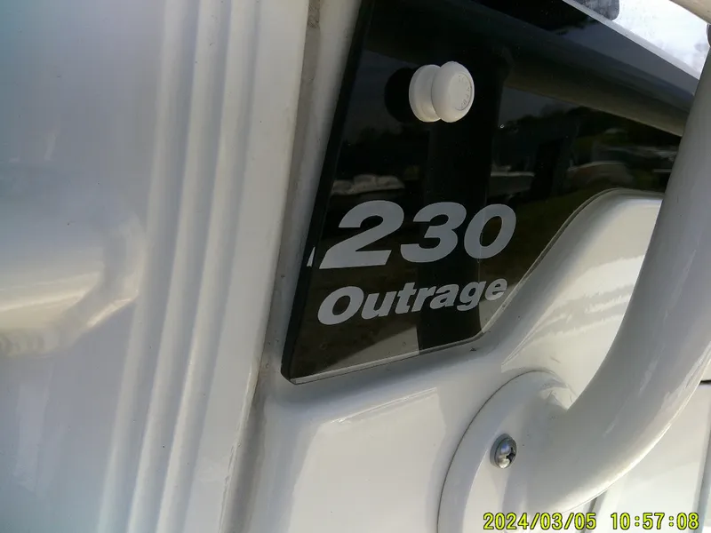Slide: The Image of Boston Whaler Outrage 230 boat, close-up view of model nameplate, 2021. - 22