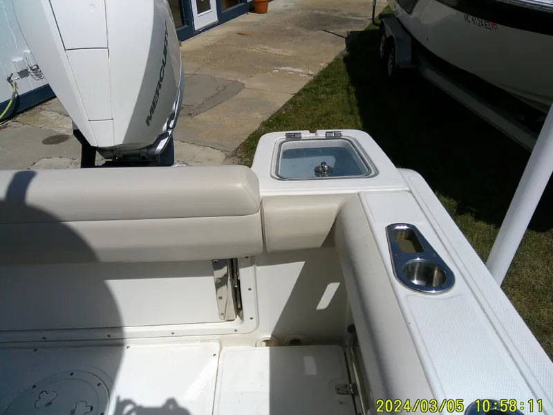 Slide: The Image of Boston Whaler Outrage 230, 2021 model, boat interior with seating and engine view. - 29