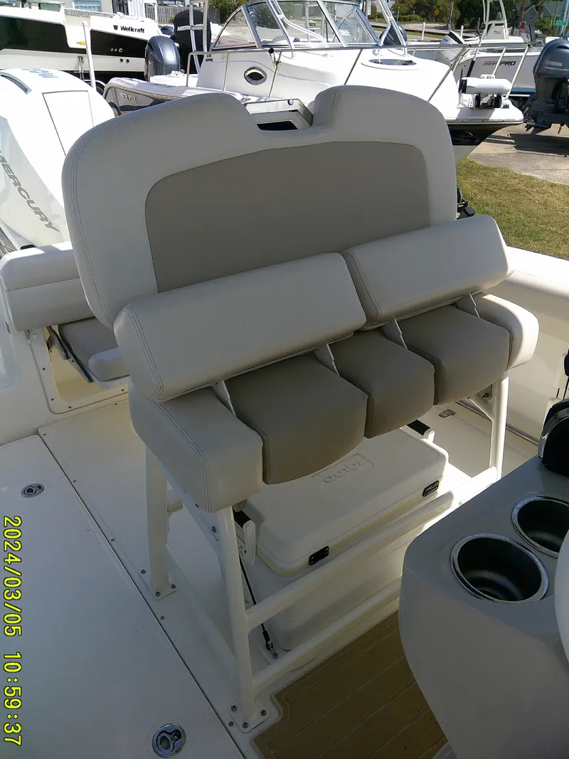 Slide: The Image of 2021 Boston Whaler Outrage 230 boat seating and console detail. - 38