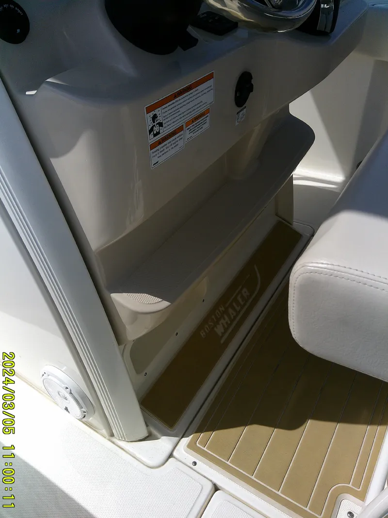 Slide: The Image of 2021 Boston Whaler Outrage 230 interior detail with seating and console. - 41