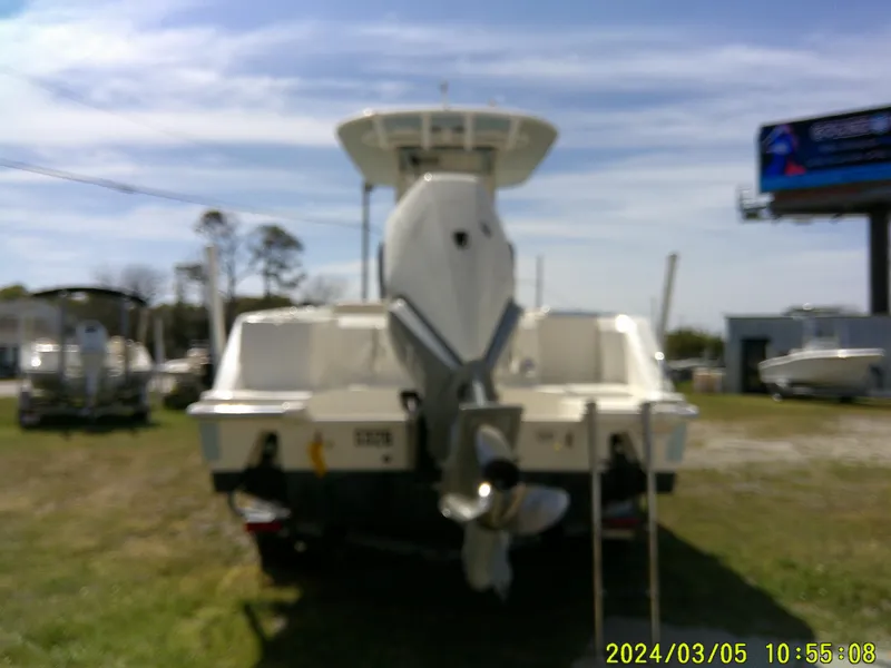 Slide: The Image of Boston Whaler Outrage 230 boat, rear view, parked outdoors, 2021 model. - 9
