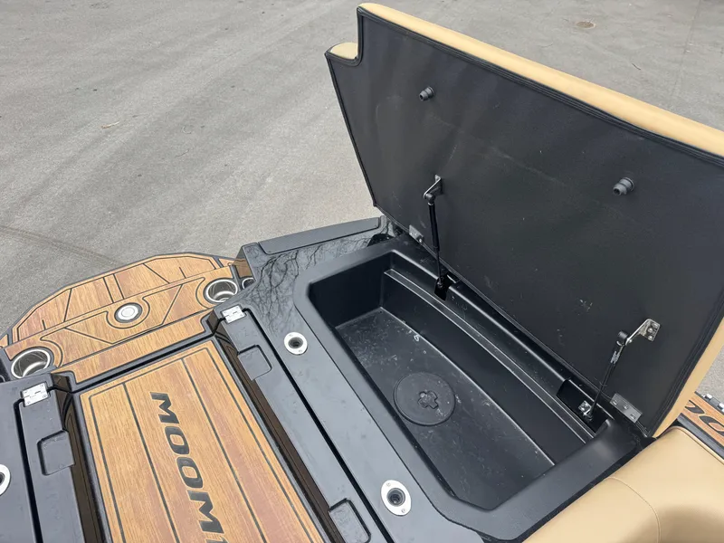 Slide: The Image of 2022 Moomba Makai boat storage compartment with open lid, showcasing spacious interior. - 14