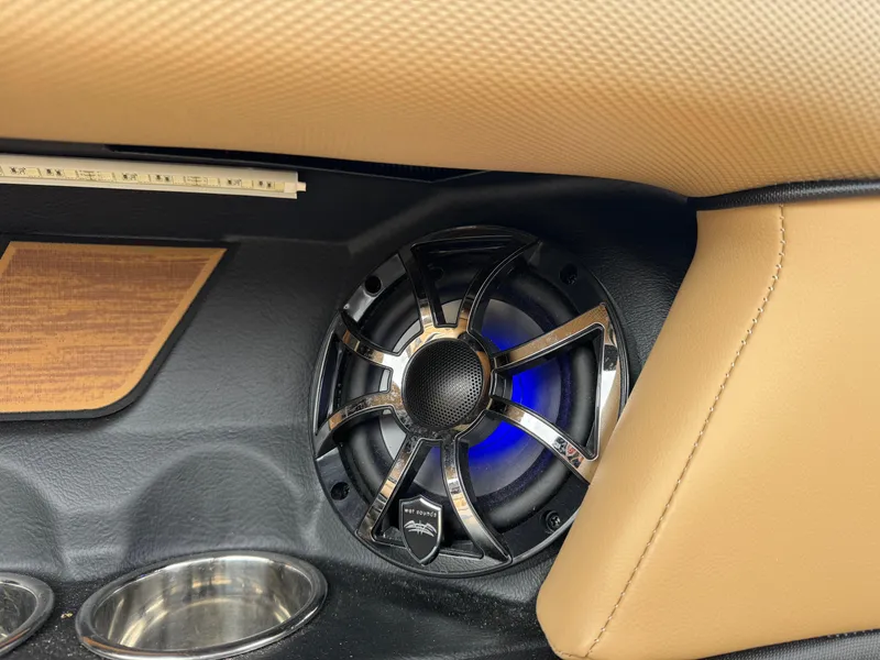 Slide: The Image of 2022 Moomba Makai interior speaker with blue LED lighting and cup holders. - 24