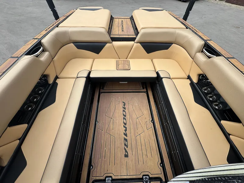 Slide: The Image of 2022 Moomba Makai boat interior with beige seating and branded flooring. - 25