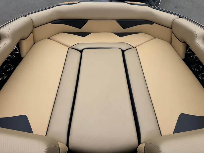 Slide: The Image of 2022 Moomba Makai boat interior with beige and black cushioned seating. - 27