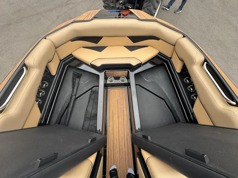 Slide: The Image of 2022 Moomba Makai boat interior with tan seating and wood accents. - 28