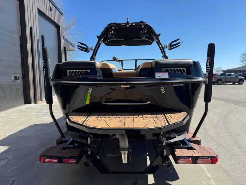 Slide: The Image of 2022 Moomba Makai boat rear view with wakeboard tower and swim platform. - 6