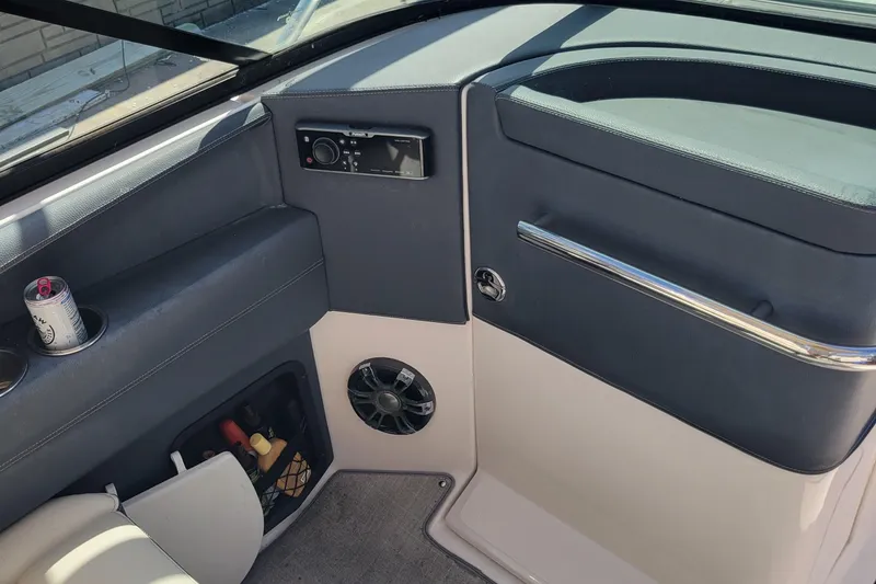 Slide: The Image of 2020 Regal 29 OBX boat interior with speaker, storage, and control panel. - 5