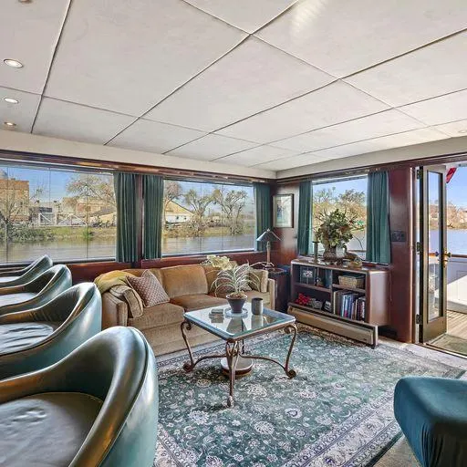 Slide: The Image of Luxurious interior of a 1991 Vic Franck 65 Motor Yacht with elegant seating and scenic views. - 27