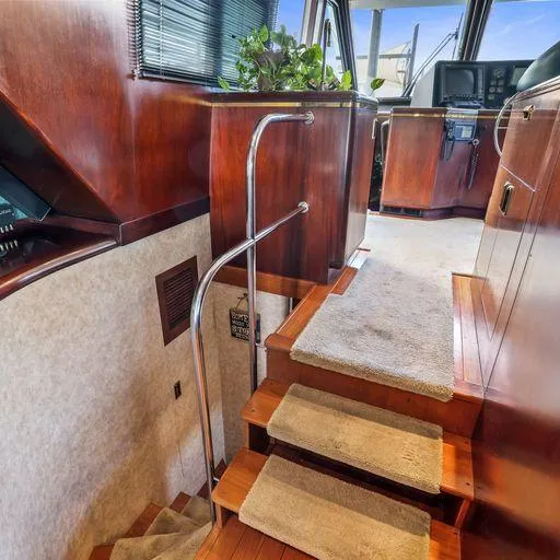 Slide: The Image of Interior of 1991 Vic Franck 65 Motor Yacht with wooden stairs and carpeted steps. - 36