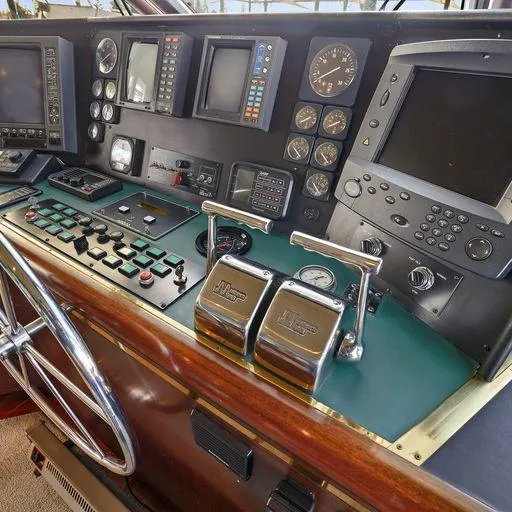Slide: The Image of Control panel of a 1991 Vic Franck 65 Motor Yacht with navigation instruments. - 39