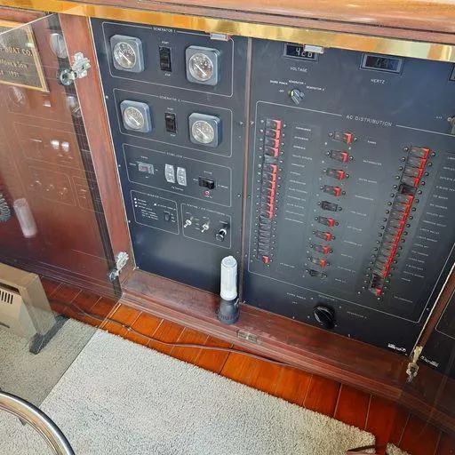 Slide: The Image of Electrical control panel on a 1991 Vic Franck 65 Motor Yacht, featuring gauges and switches. - 40