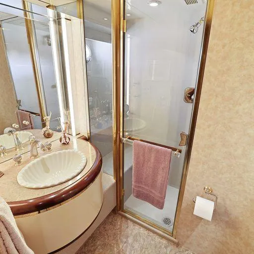 Slide: The Image of Luxurious bathroom in 1991 Vic Franck 65 Motor Yacht with gold accents and elegant fixtures. - 46