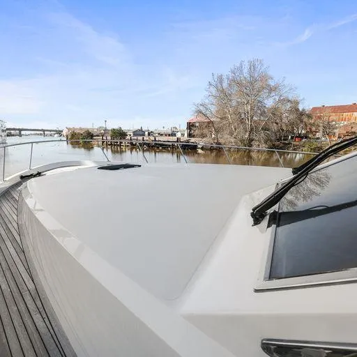 Slide: The Image of 1991 Vic Franck 65 Motor Yacht on calm river with clear sky. - 9