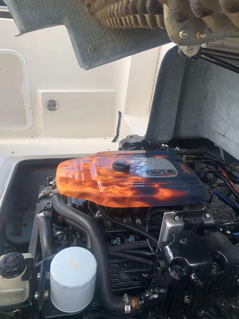 Slide: The Image of 1998 Sea Ray 240 Sundeck engine with custom flame-painted cover. - 16