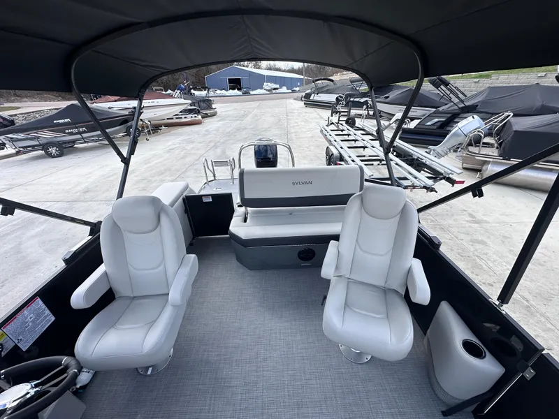 Slide: The Image of 2025 Sylvan Mirage X X5 CLZ DH pontoon boat interior with seating and helm. - 11
