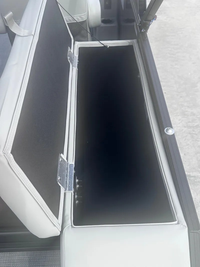 Slide: The Image of Open storage compartment in 2025 Sylvan Mirage X X5 CLZ DH boat. - 12