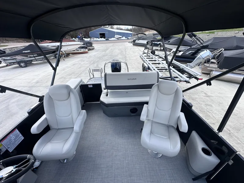 Slide: The Image of 2025 Sylvan Mirage X X5 CLZ DH pontoon boat interior with seating and helm. - 13