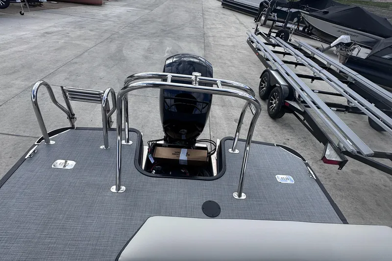 Slide: The Image of 2025 Sylvan Mirage X X5 CLZ DH pontoon boat with outboard motor and trailer. - 14