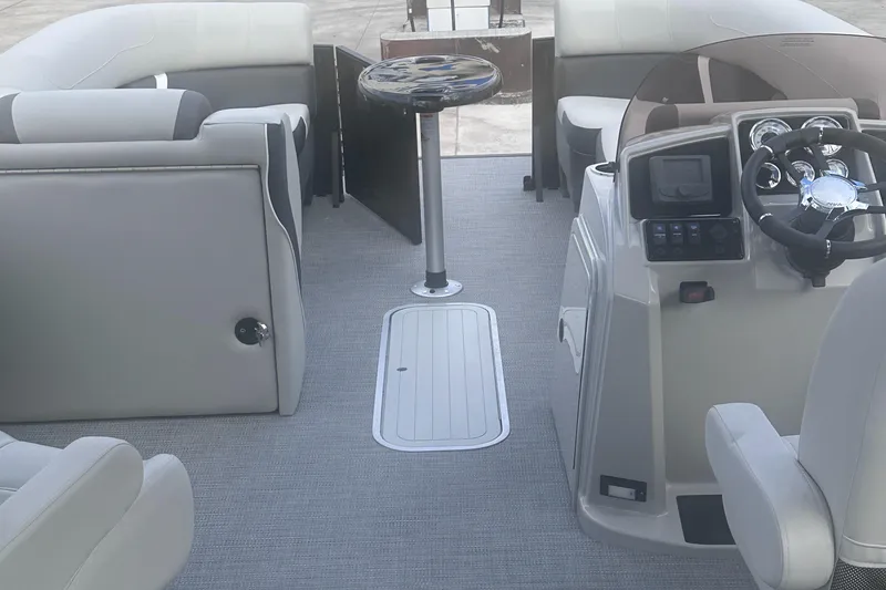 Slide: The Image of 2025 Sylvan Mirage X X5 CLZ DH pontoon boat interior with helm and seating. - 15