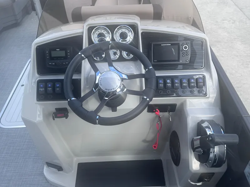 Slide: The Image of 2025 Sylvan Mirage X X5 CLZ DH boat dashboard with steering wheel and control panel. - 7